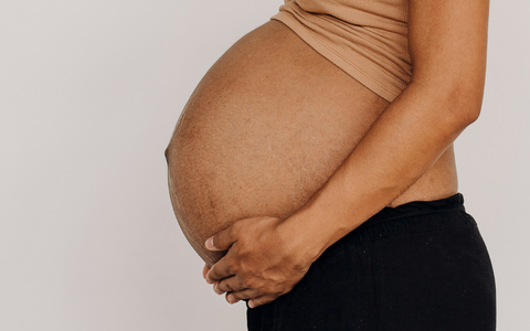 How is the baby positioned in the womb?