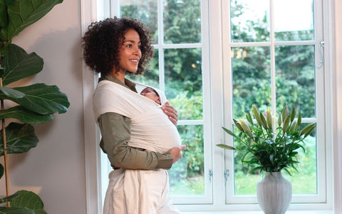 Postpartum workout with a baby wrap